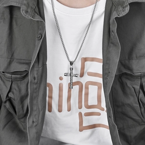 Twisted texture stainless steel cross pendant necklace for men worn on model