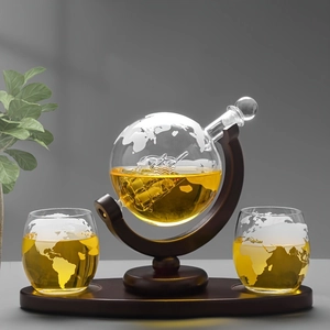 Globe whiskey decanter set with glass ship inside, wood base and map engraved glasses