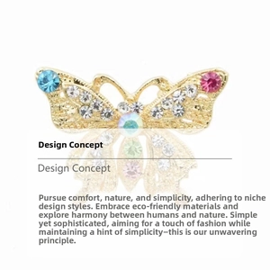 Detail of colorful butterfly brooch with multi-colored crystals and gold plating finish