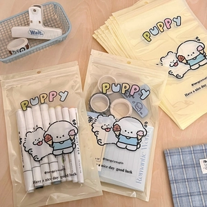 Detail of cute puppy frosted storage bag showing stationery capacity and sealing