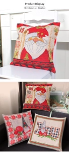Close-up of linen Christmas pillowcases with Santa and Gnome motifs on a chair