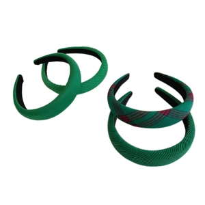 Set of four green padded headbands featuring plaid, quilted, and solid fabric textures