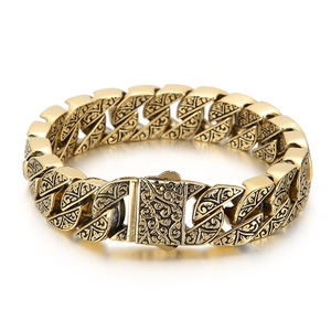 Vintage gold chunky chain bracelet featuring intricate engraved floral patterns on links