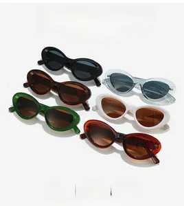 Close-up of cat-eye sunglasses in multiple colors including black, brown, and green