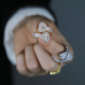Close-up of luxury rose gold heart rings set with pavé diamonds and T-square zircons