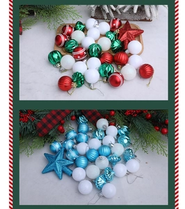 Close-up of assorted Christmas ornaments in matte, glossy, and glitter textures with pine décor