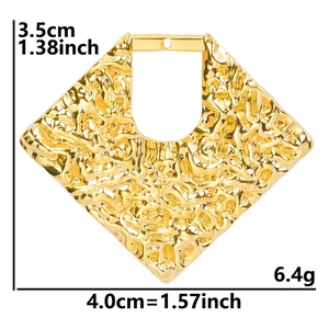 Detailed view of 18k gold plated stainless steel earring with irregular texture and size
