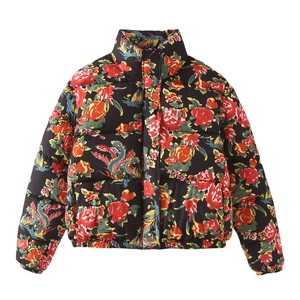 Detail view of ethnic print puffer jacket with red peony and cyan dragon patterns