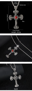 Detail view of silver cross pendant with red gemstone showing exact size and material specs