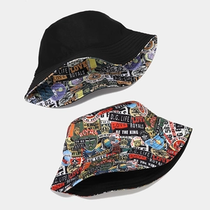 Detail showing reversible bucket hat with colorful street graffiti print and black side