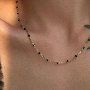 Minimalist 18k gold plated stainless steel necklace with black beads on model