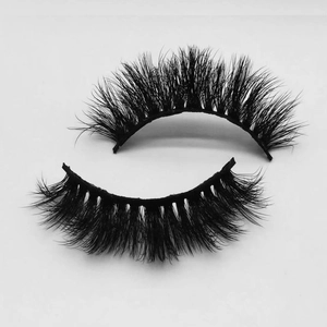 Macro detail of thick curly black false eyelashes with layered texture and firm stem