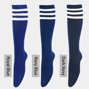 Detailed knit texture of three shades of blue knee-high socks with white athletic stripes
