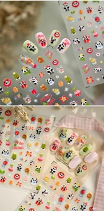 Detailed view of Christmas panda nail art stickers with trees and gingerbread motifs