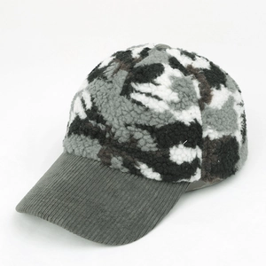 Detail view of winter camouflage sherpa baseball cap with grey corduroy brim texture