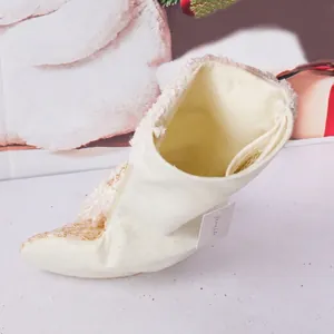 Cream Christmas stocking with white faux fur trim and gold sequin patterns for holiday decor