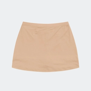 Detail of light beige elastic pleated skirt showing fine knit texture and smooth fabric