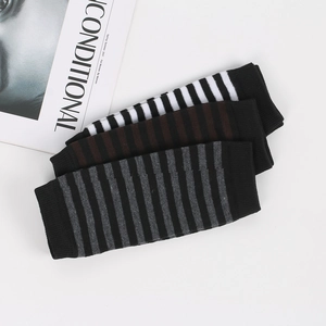 Detailed knit texture of striped arm warmers in black, grey, and brown color sets