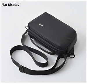 Detail of black sporty crossbody bag featuring a durable nylon fabric and SPORT logo