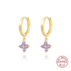 Macro detail of S925 sterling silver hoop earrings with purple zircon flower pendants