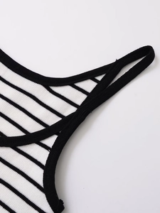 Close-up of contrast striped knit camisole showing shoulder strap stitching detail