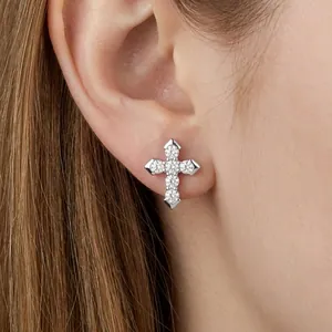 Elegant S925 sterling silver cross stud earring featuring sparkling zircon stones on ear