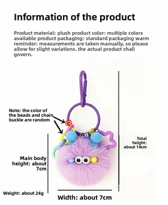 Detail of purple plush monster keychain with letter beads and size specs, 14cm total height