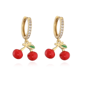 Detail of golden cherry pendant earrings with red enamel fruits and white zircon accents
