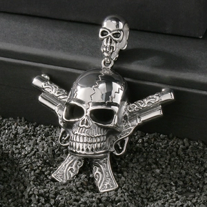 Detailed view of punk stainless steel skull pendant with crossed revolvers on black stones