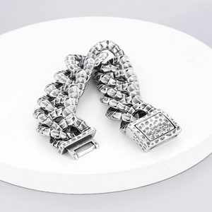 Macro shot of heavy industrial snake scale pattern chain with vintage silver finish