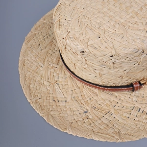 Premium handmade woven raffia sun hat with flat top and brown leather band detail