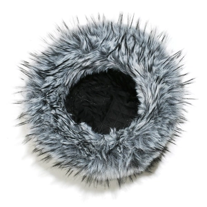 Detail of the warm black and gray faux fox fur exterior and quilted black lining of the hat