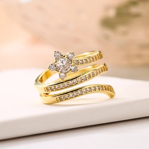 Elegant gold-plated triple spiral ring with a crystal flower design and micro-pavé accents