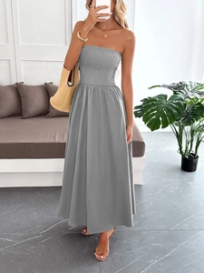 Detail showing the elastic smocked bodice and linen texture of the grey tube maxi dress