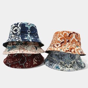 Detailed stack of vintage baroque pattern bucket hats in multiple colors and textures