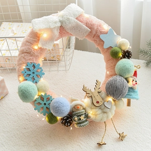 Pink Christmas wool felt wreath with reindeer, LED lights and festive ornaments