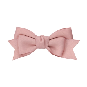 Elegant pink satin bow hair clip in ballet style for girls featuring smooth fabric texture