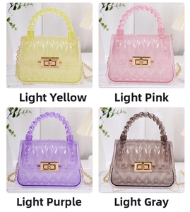 Detailed view of mini PVC leaf pattern jelly bags in yellow, pink, purple, and grey