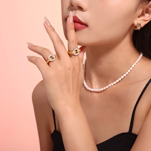 Fashion 18k gold plated ring with pavé rhinestones worn with pearl necklace