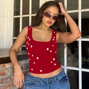 Close-up of dark red ribbed knit tank top with white bead accents and square neckline