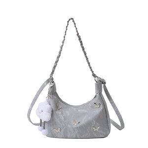 Grey ruched shoulder bag with silver butterfly accent and plush cloud charm strap