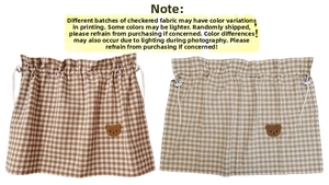 Detail view of plaid car curtains with drawstring design and cute bear patches