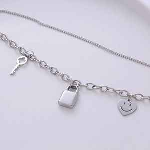 Hip hop titanium steel necklace with key, lock and smile heart pendants in silver finish