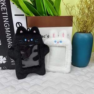 Detail of plush cat and rabbit card holders with transparent photo window and embroidery