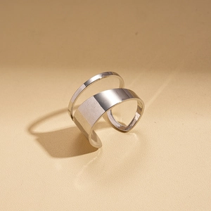 Detail view of silver minimalist double-layered open ring with polished metal finish