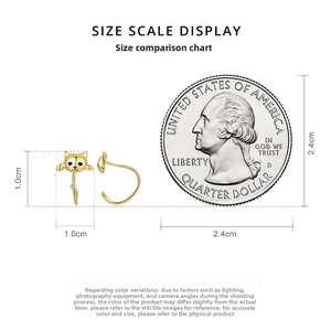 Size scale display of golden cat stud earrings shown next to a quarter coin