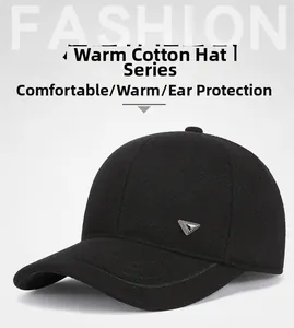 Detailed close-up of a black winter baseball cap with ear protection and metal logo plate