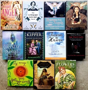 Detailed collection of various Oracle and Tarot card decks in their original packaging