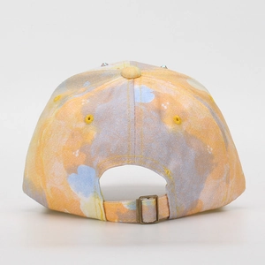 Detail of colorful marble tie-dye baseball cap with adjustable gold metal buckle back