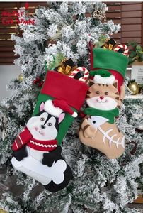 Detail of creative 3D cartoon cat and dog Christmas stockings with faux gifts on tree